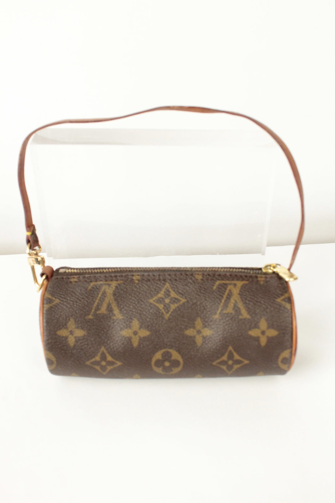 Louis Vuitton brown micro mini pouch bag with monogram pattern and vachetta leather trim.