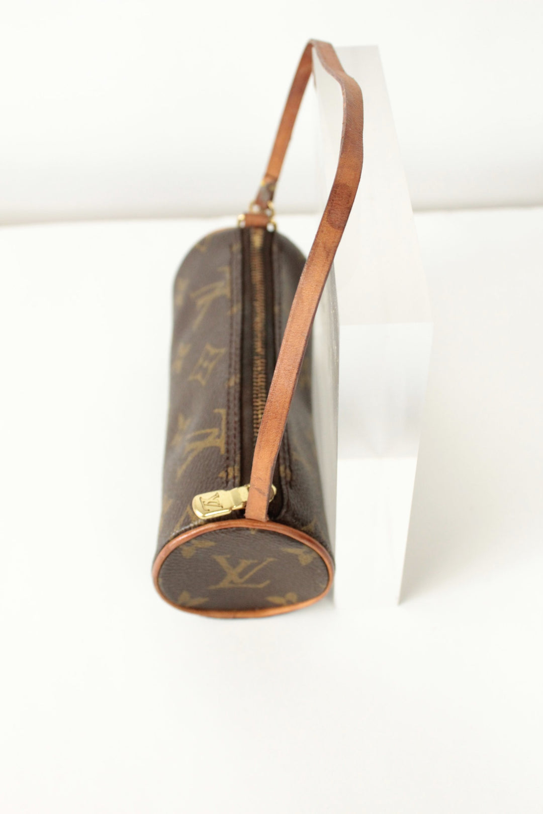 Louis Vuitton brown micro mini pouch bag with monogram pattern and vachetta leather trim.