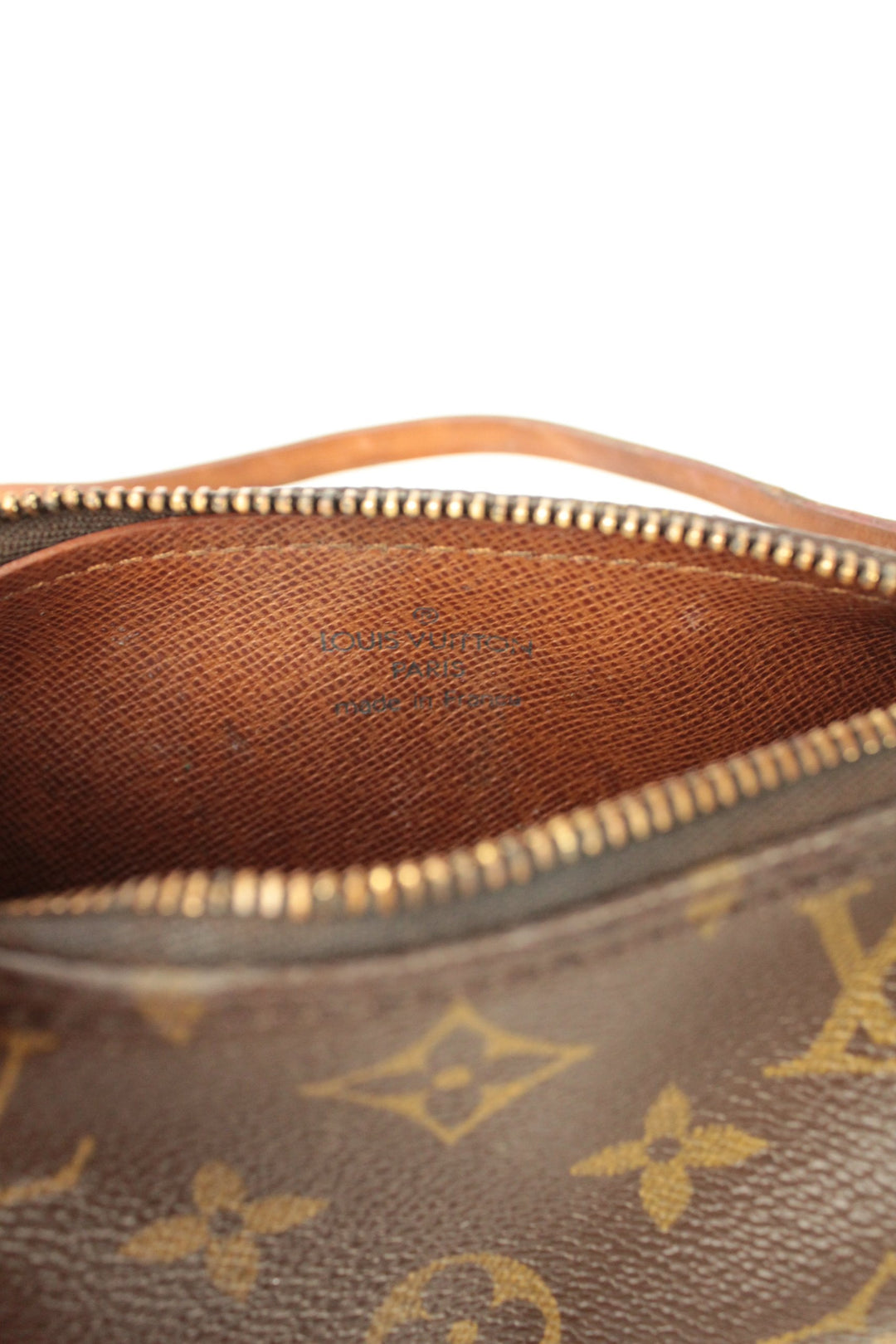 Louis Vuitton brown micro mini pouch bag with monogram pattern and vachetta leather trim.