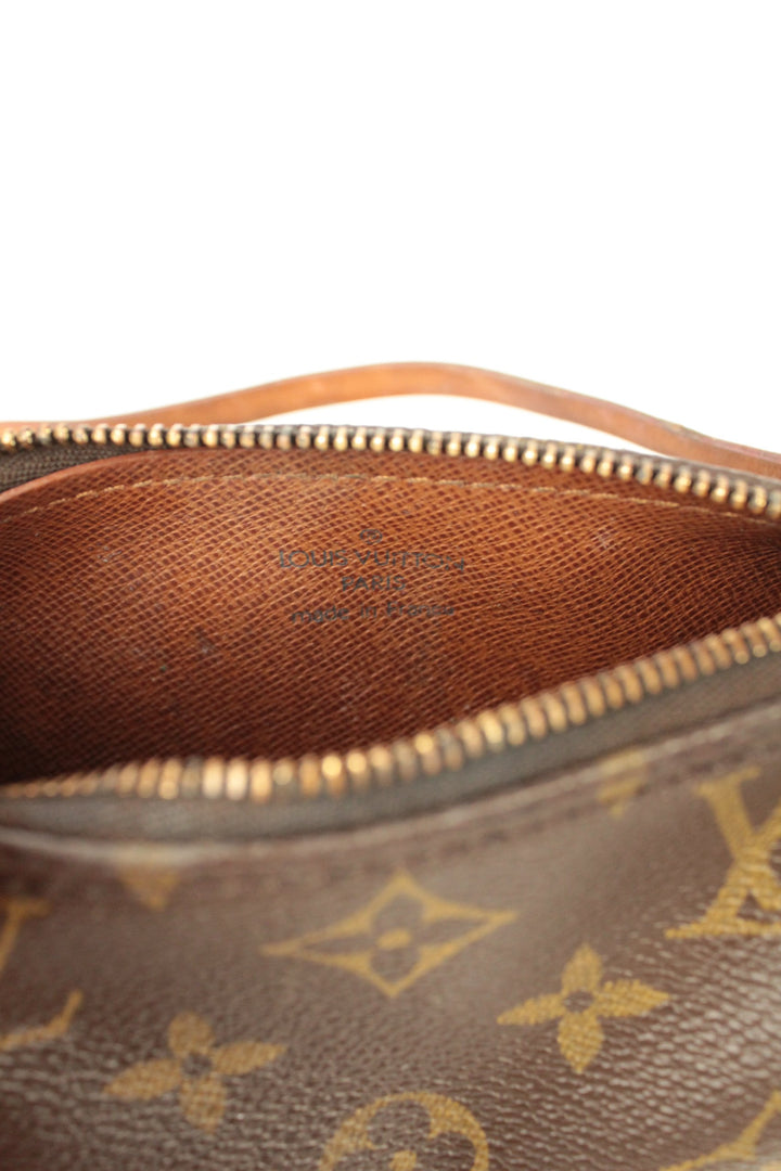 Louis Vuitton brown micro mini pouch bag with monogram pattern and vachetta leather trim.